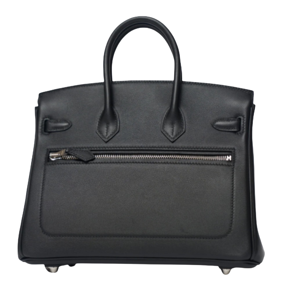 Hermes Birkin 25 Rock Black Evercalf back view, highlighting the sleek smooth leather finish, external zip pocket detail, structured proportions, and protective base feet.