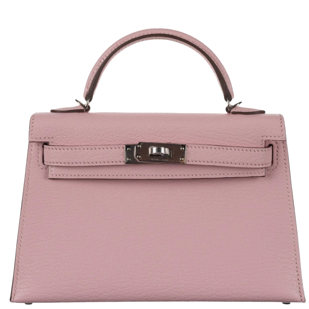 Hermes Mini Kelly 20 Sellier Rose Sakura Chevre front view, showcasing the miniature architectural silhouette, rigid structure, and silver turn-lock closure.