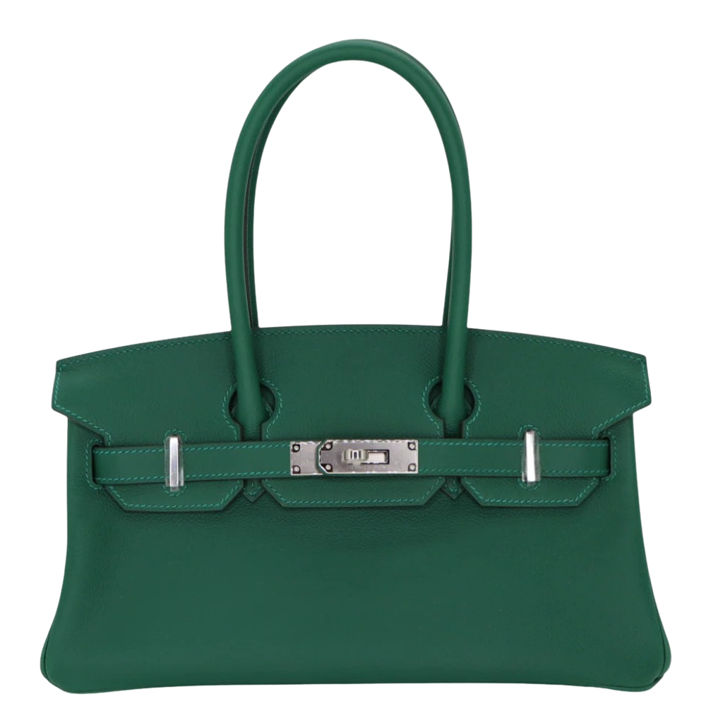 Hermes Shoulder Birkin 29 Vert Moyen Evercolor front view, showcasing the elongated horizontal silhouette, vibrant medium green leather, long shoulder handles, and silver turn-lock hardware.