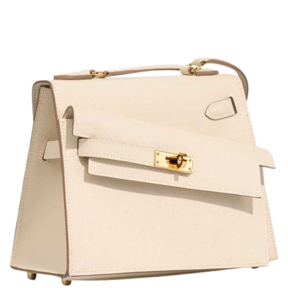 Hermes Kelly 20 Mini En Désordre Craie Epsom left side profile, displaying the unusual flipped gusset and unique silhouette.