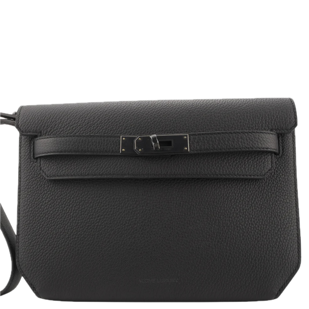 A black Kelly Depeche Hermès leather crossbody bag with a front flap and a central metal turn-lock closure, for men.