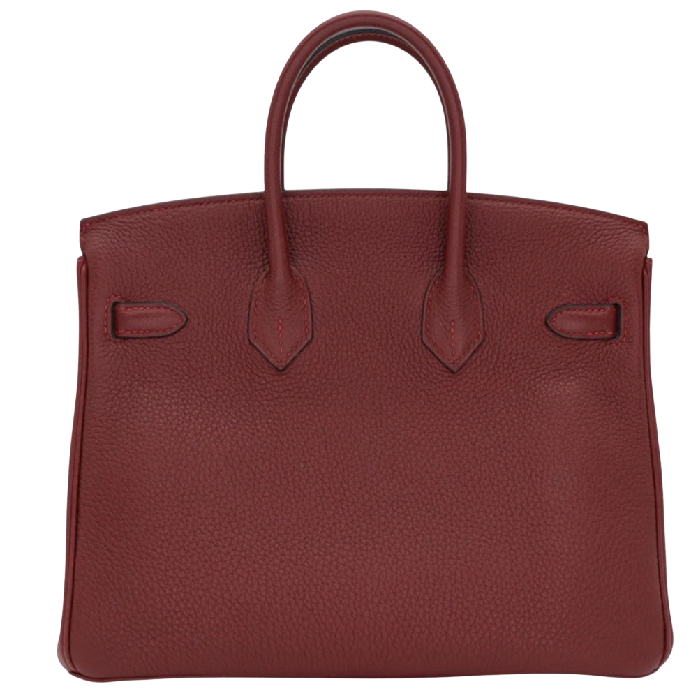 Hermes Birkin 25 Rouge H Togo back view, highlighting the clean proportions, natural grained leather finish, and protective metal feet.