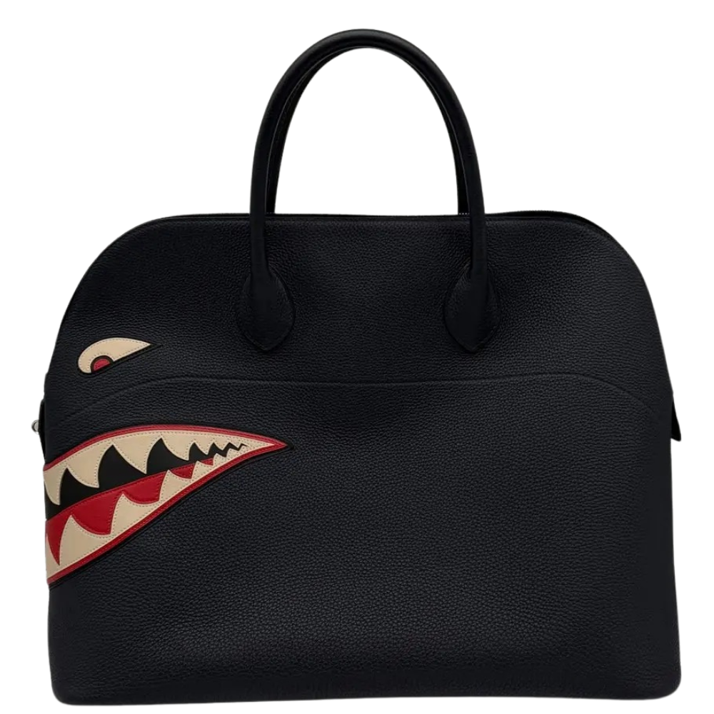 Hermes Bolide Shark 45 Bleu Nuit Togo front view, showcasing the iconic travel dome shape, whimsical shark mouth applique, and top handles.