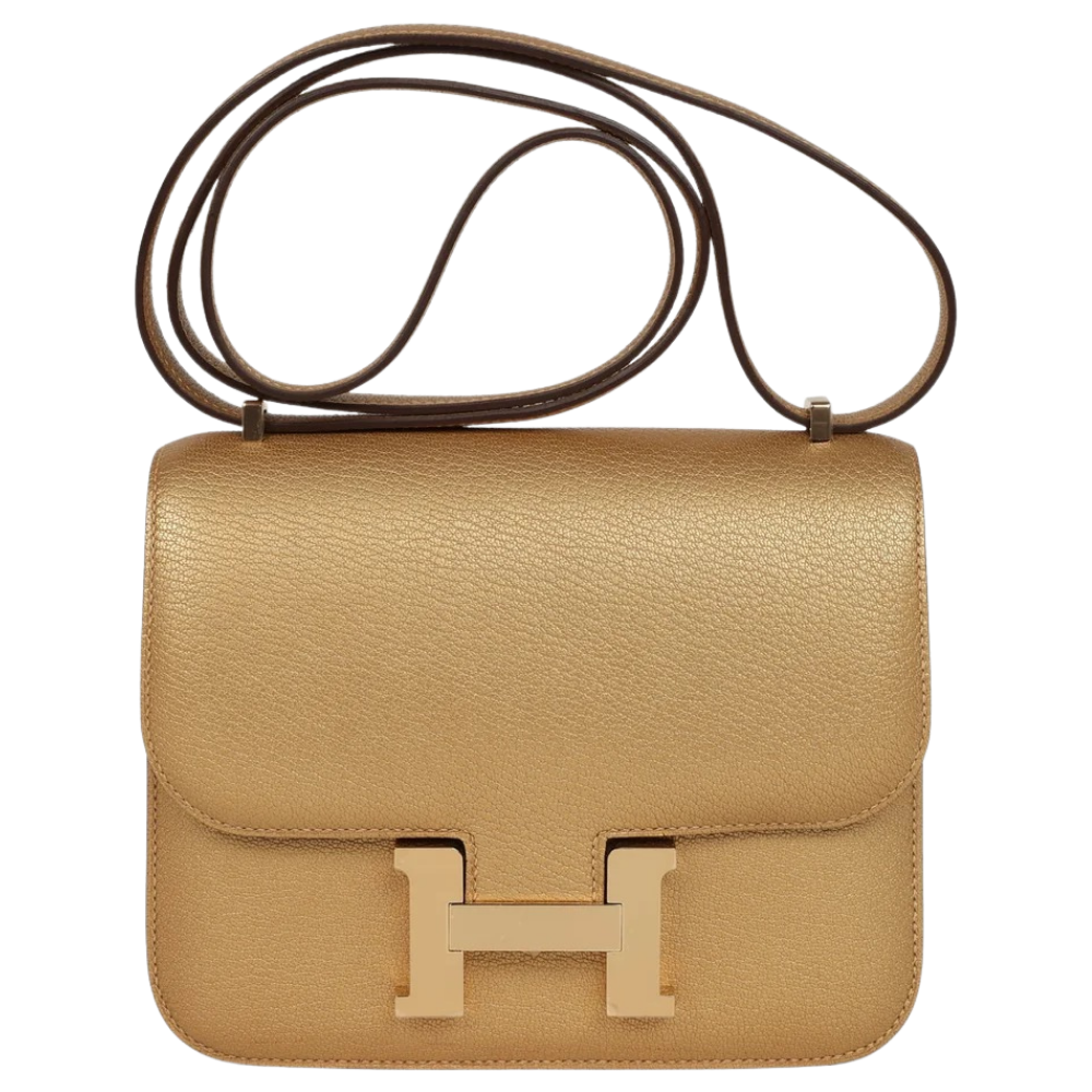 Hermes Constance 18 Dore Chamkilight Chevre front view, showcasing the iconic H clasp and structured flap design.