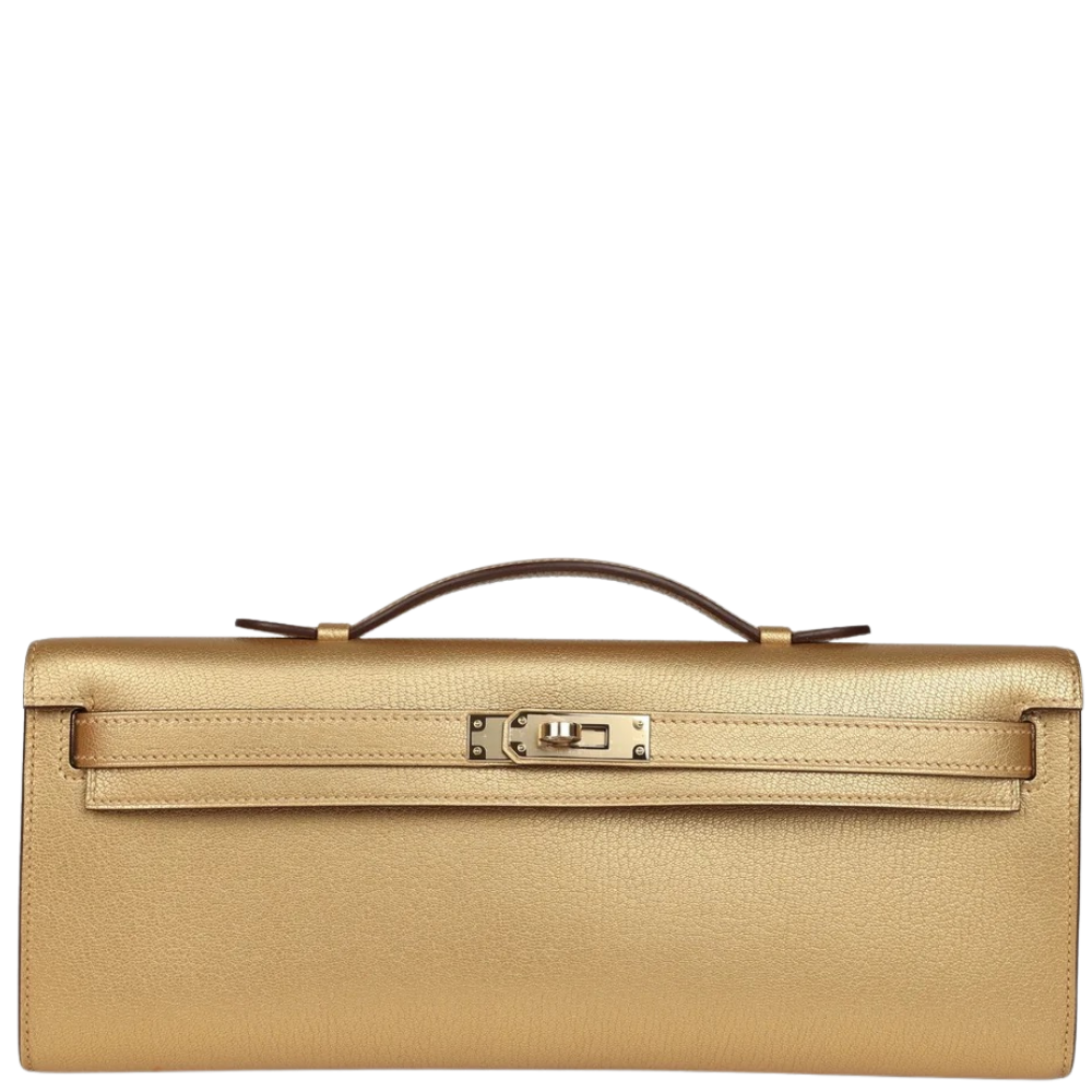 Hermes Kelly Cut Dore Chevre Chamkilight front view, showcasing the sleek elongated clutch silhouette and iconic turn-lock closure.