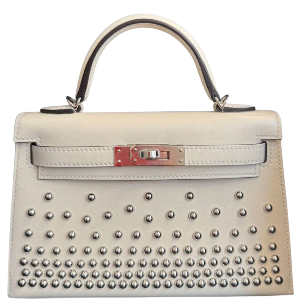 Hermes Kelly 20 Mini Clouté Cream front view, showcasing the unique studded embellishments and structured Sellier silhouette.