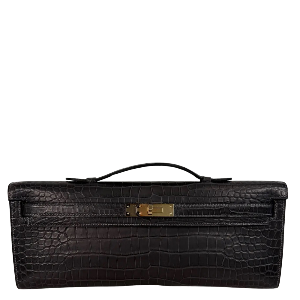 Hermes Kelly Cut Graphite Matte Porosus front view, showcasing the sleek elongated clutch silhouette, symmetrical square scales, and turn-lock closure.