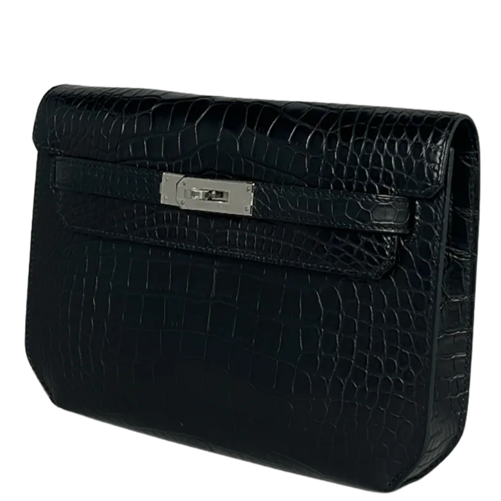 Side view of Hermès Kelly Dépêche in black alligator leather, silver hardware