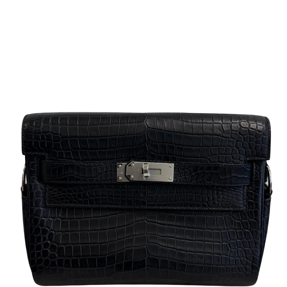 Hermes Kelly Messenger PM Black Matte Porosus front view, showcasing the contemporary crossbody silhouette, symmetrical square scales, and iconic turn-lock closure.