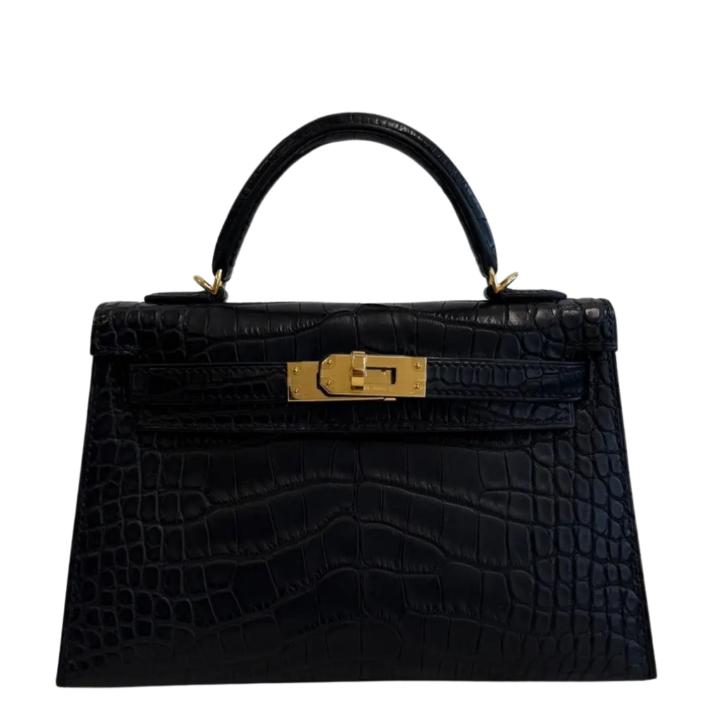 Hermes Mini Kelly 20 Black Matte Alligator front view, showcasing the miniature Sellier silhouette, symmetrical square scales, and iconic turn-lock closure.